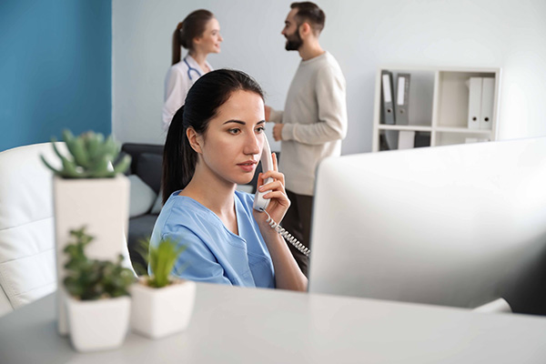 Clinic receptionist calling Snap Remedy to fix computer issues